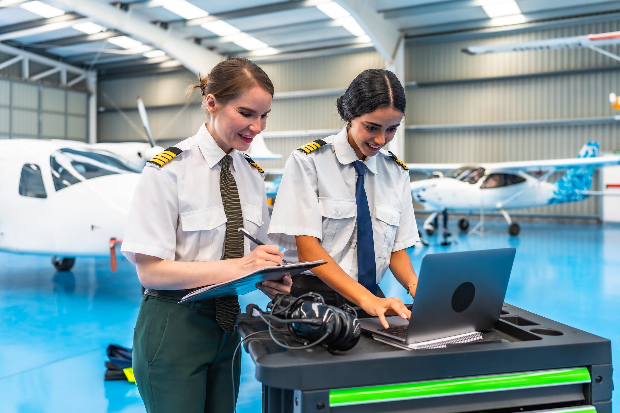 Two pilots reviewing flight plans